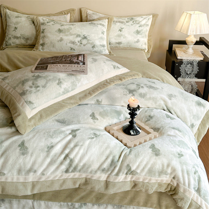 Luxurious quilted bedding set with velvet trim and floral branch motif