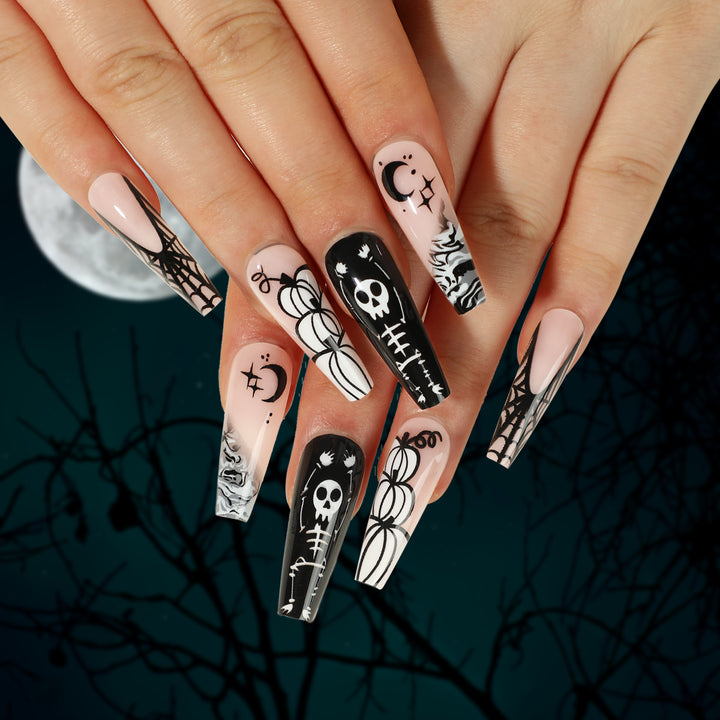Artificial nail art in Halloween style with graffiti designs Stornfield