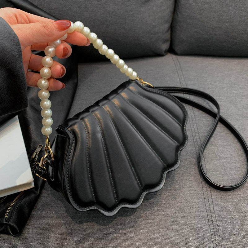 Elegant Pearl-Handled Clutch