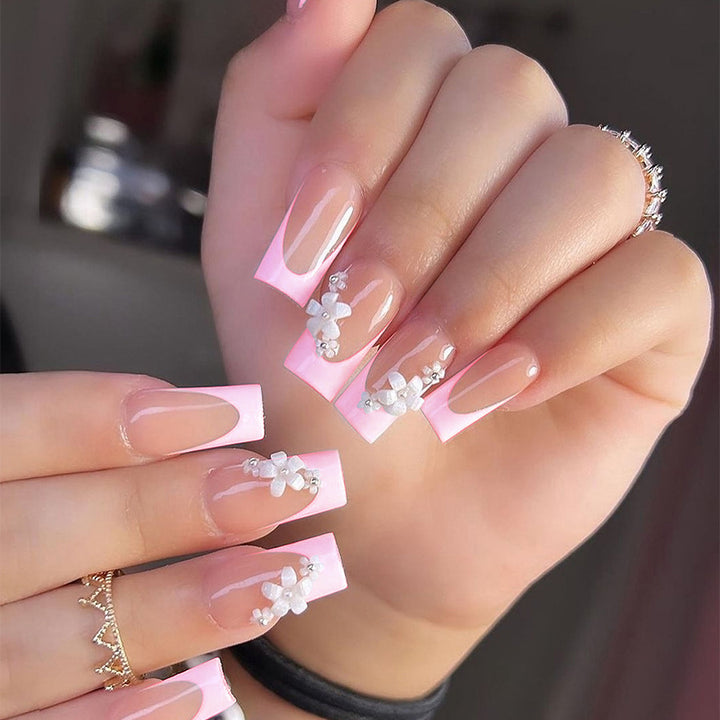 Artificial nail set with elegant French tips and hand-drawn flower motifs Stornfield