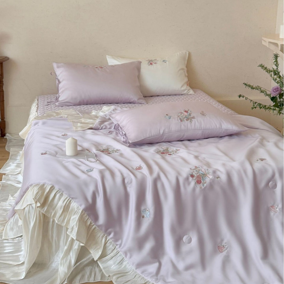 Romantic satin bedding set with ruffle, floral embroidery and tie pillow