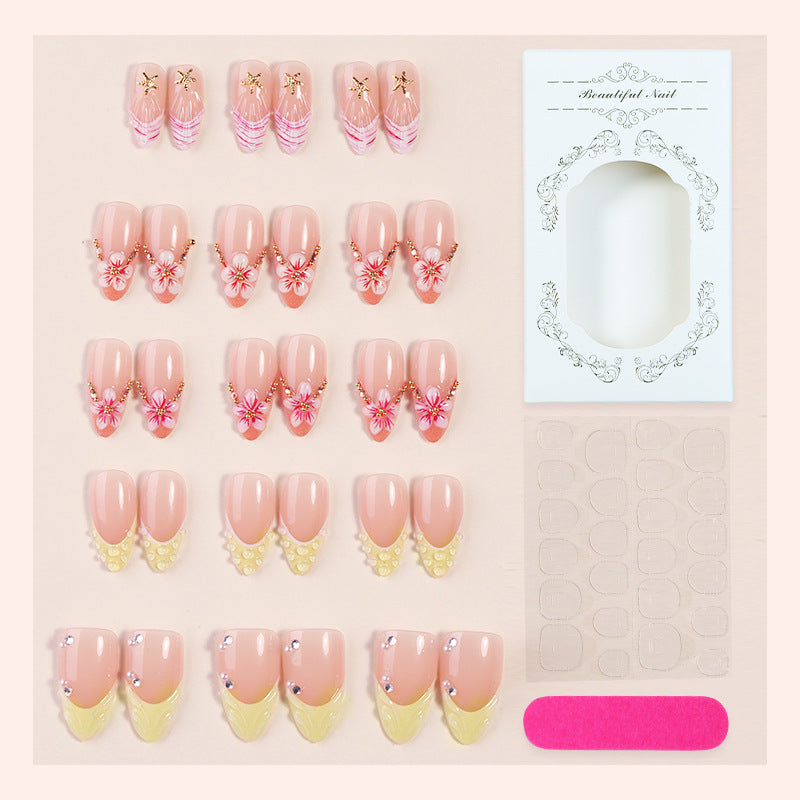 Artificial nail set with glamorous floral and glitter decorations Stornfield