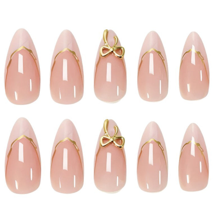 Artificial nails with elegant tip decorations and golden accents Stornfield