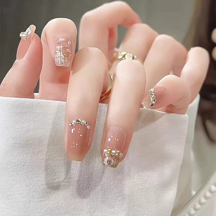 Artistic Press-On Nail Set with Elegant Floral and Decorative Accents Stornfield