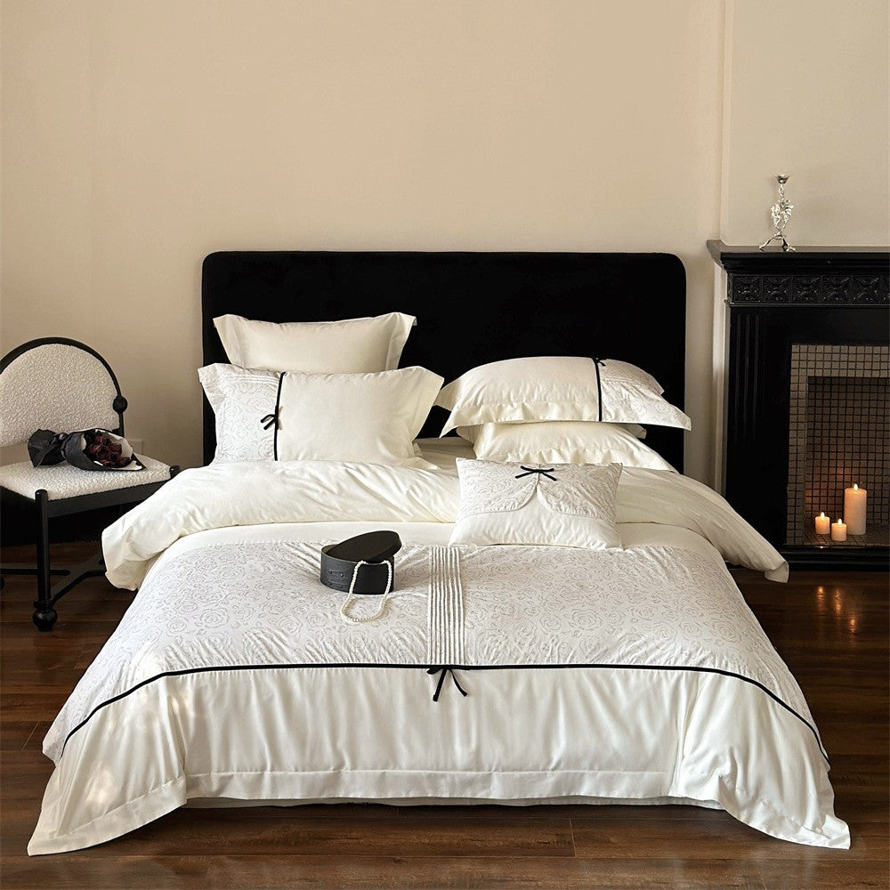 Reversible Duvet Cover Bedding Set with Quilted Jacquard Panel, Black Piped Trim & Decorative Bow Shams