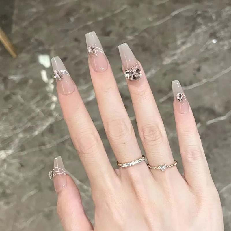 Art nail set with filigree decorations and glamorous accents Stornfield