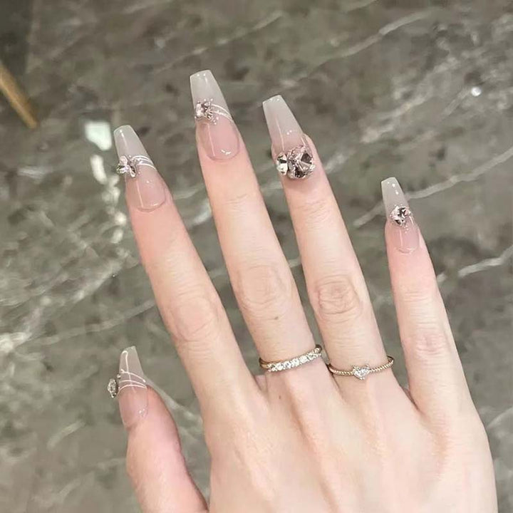 Art nail set with filigree decorations and glamorous accents Stornfield