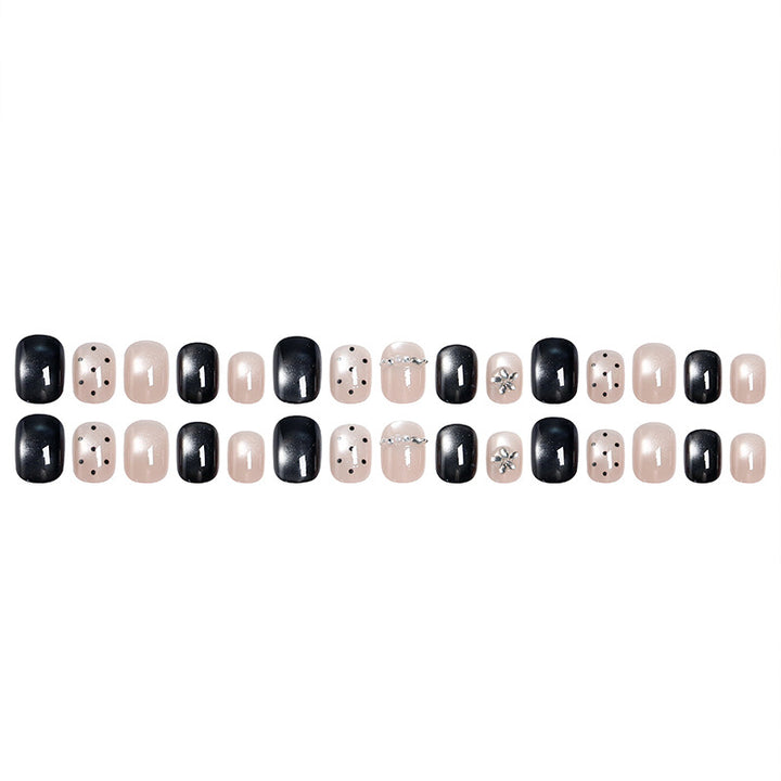 Acrylic nail set with glamorous accents and delicate designs Stornfield