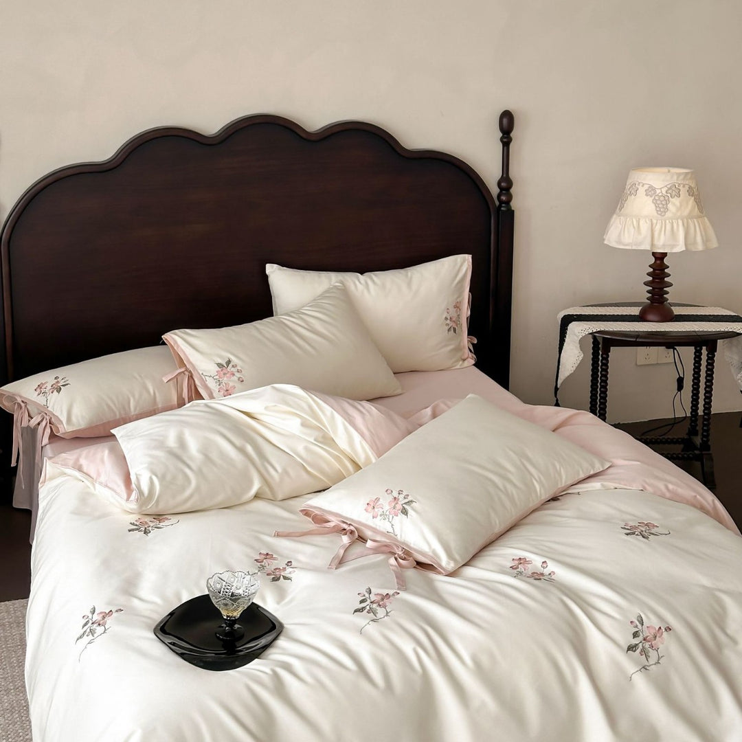 Satin bed cover set with embroidered rose branches, bow ties and silky-matte finish