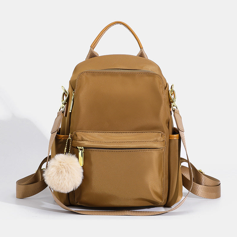 Versatile Multi-Pocket Backpack with Stylish Pom-Pom