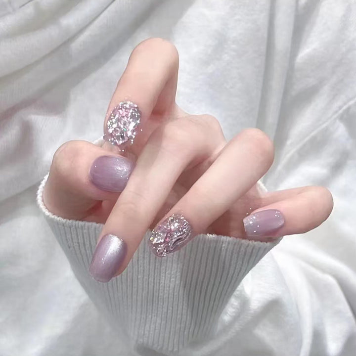 Artificial nail set with glitter and metallic effects Stornfield