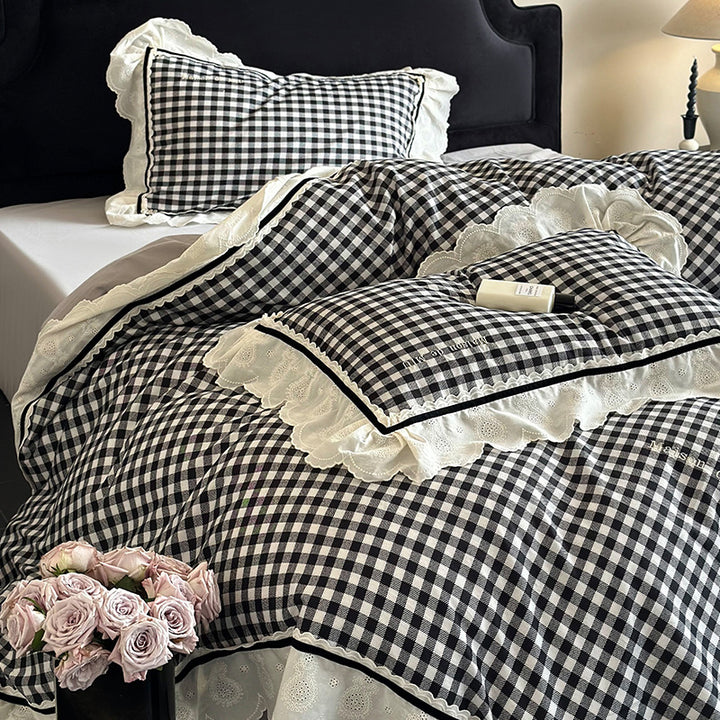 Quilted bedding set made of cotton blend with check pattern and decorative lace ruffle