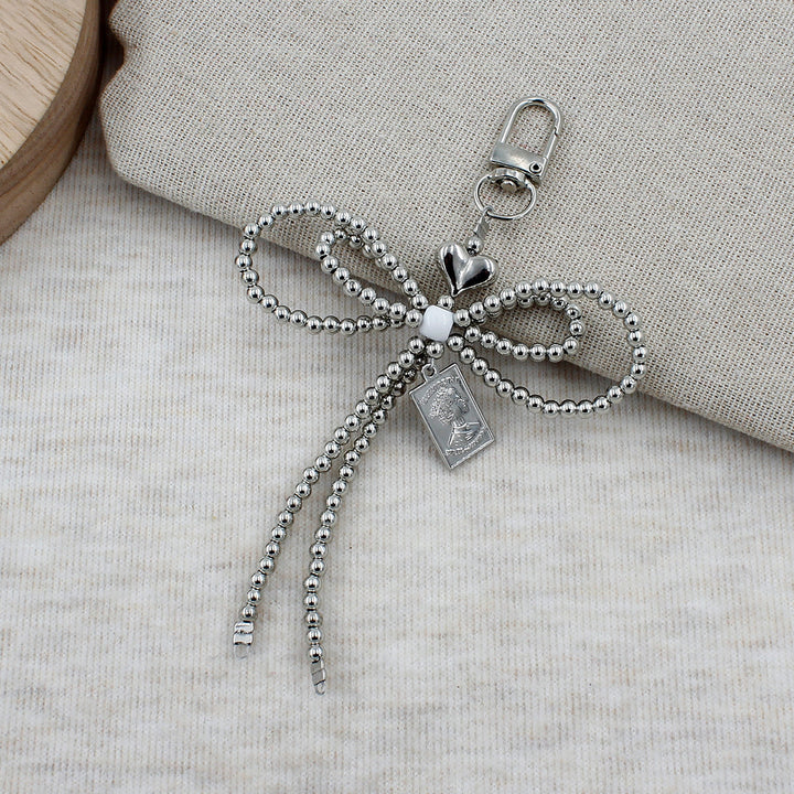Elegant Beaded Bow Brooch Stornfield