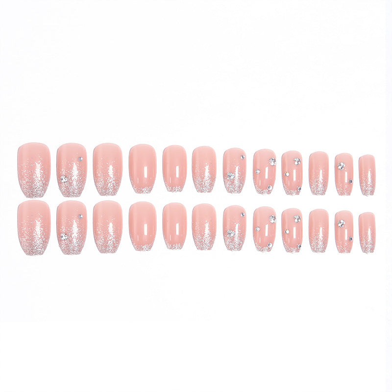 Glamorous artificial nails with glitter and rhinestone embellishments Stornfield