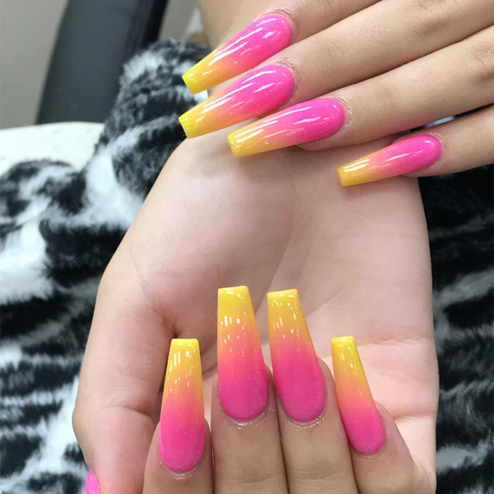 Artificial nail tips in modern ombre design Stornfield