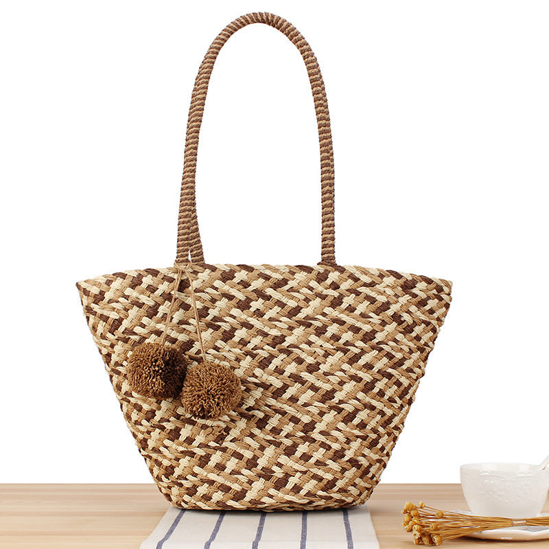 Summer wicker handbag with pom poms Stornfield