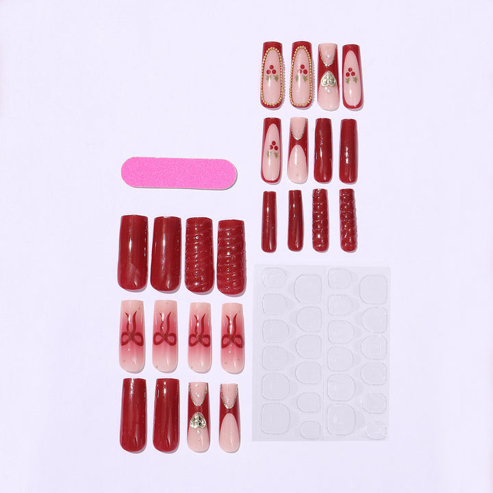 Artificial nail set with festive accents and glitter embellishments Stornfield