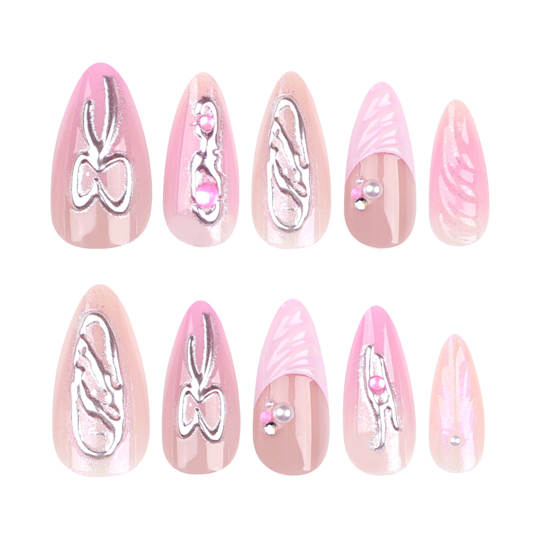 Artful stiletto nails with glitter and pearl decorations Stornfield