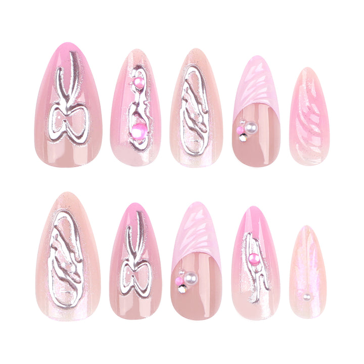Artful stiletto nails with glitter and pearl decorations Stornfield