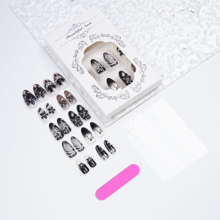 Elegant acrylic nail set with complex designs Stornfield