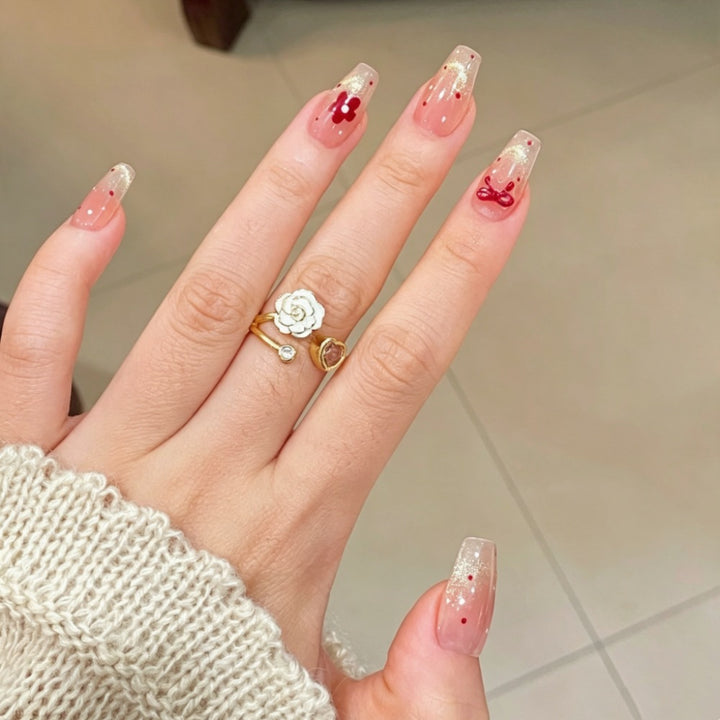 Artificial nails with sparkling accents and delicate patterns Stornfield