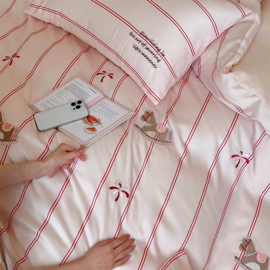 Children's bedding set with satin look, fine stripes and rocking horse appliqués