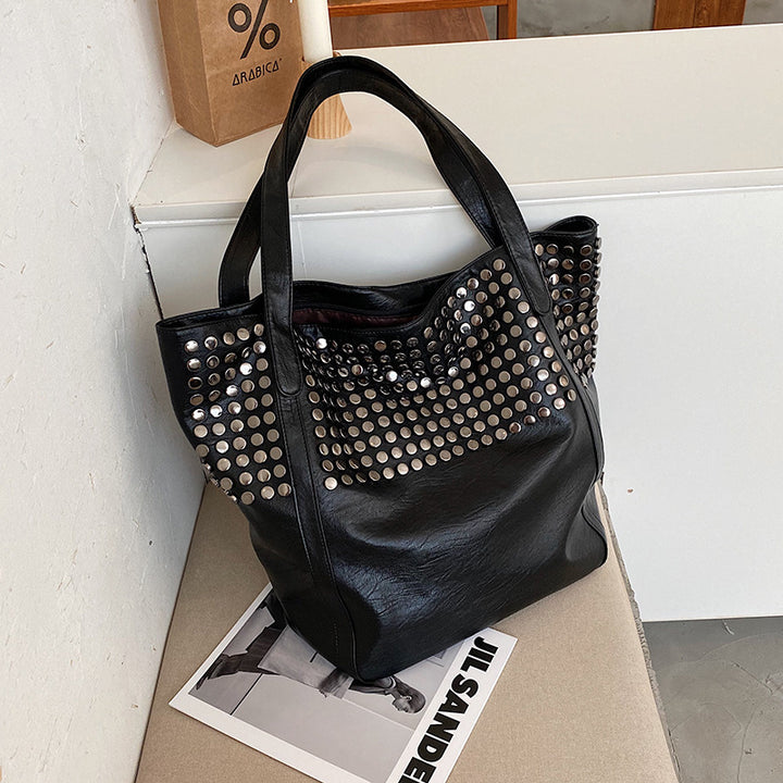Fashionable shoulder bag with stylish rivet details Stornfield