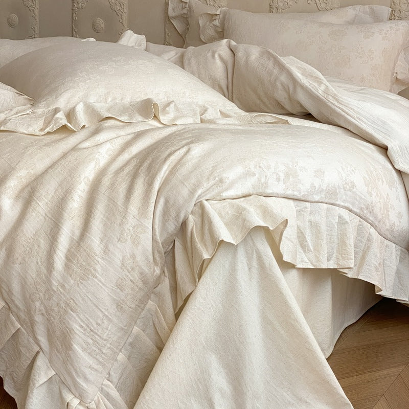 Jacquard bedding set with decorative ruffle border and floral relief
