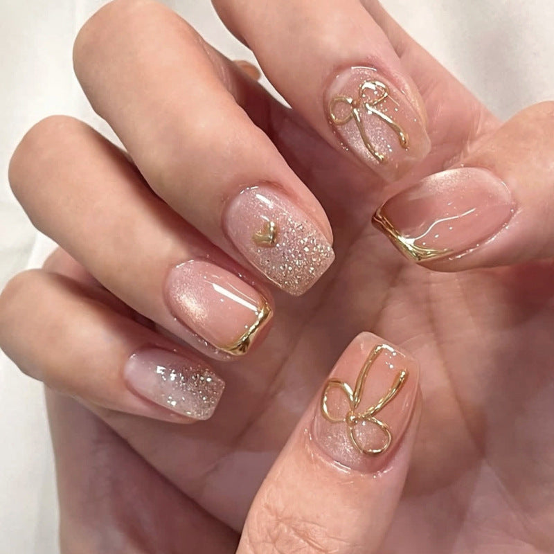 Glamorous acrylic nails with elegant gold design Stornfield