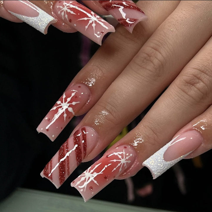 Acrylic nail set with festive candy cane and glitter accents Stornfield