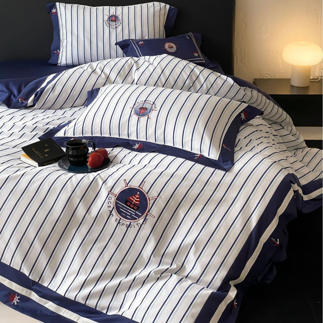 Maritime cotton satin bedding set with fine stripes, nautical embroidery, and reversible pillow