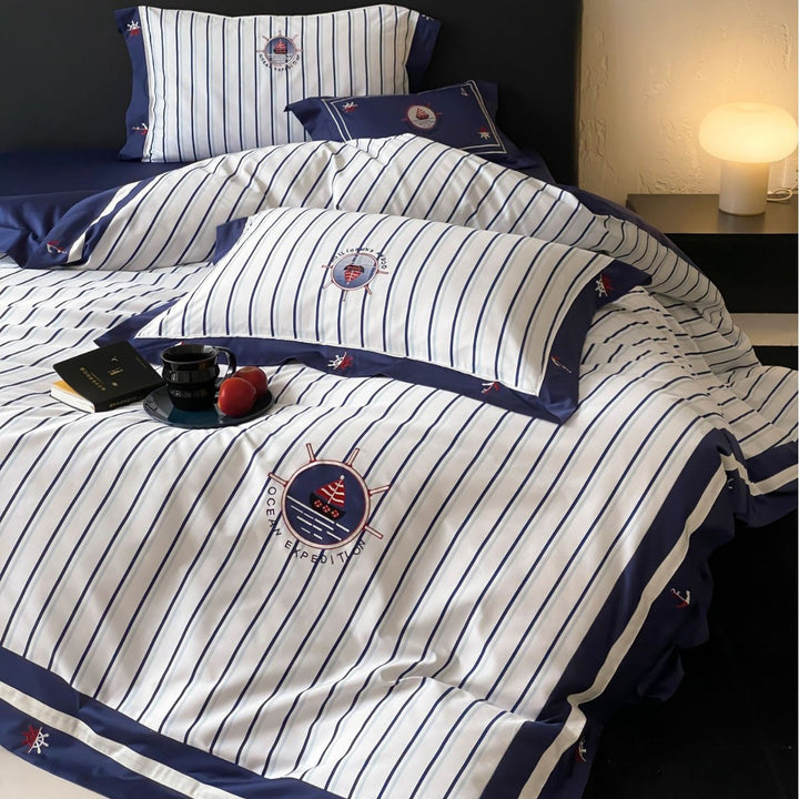 Maritime cotton satin bedding set with fine stripes, nautical embroidery, and reversible pillow