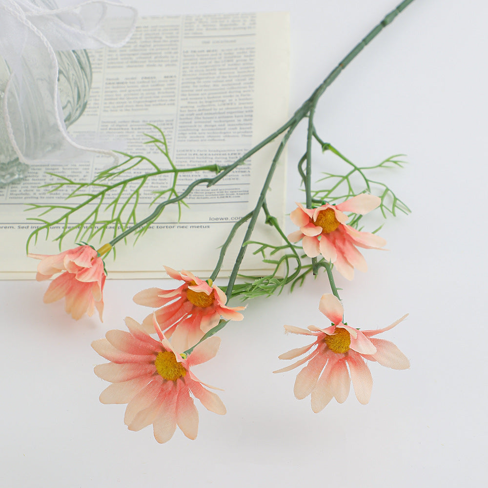 Artificial flower branch with bright blooms and delicate leaves