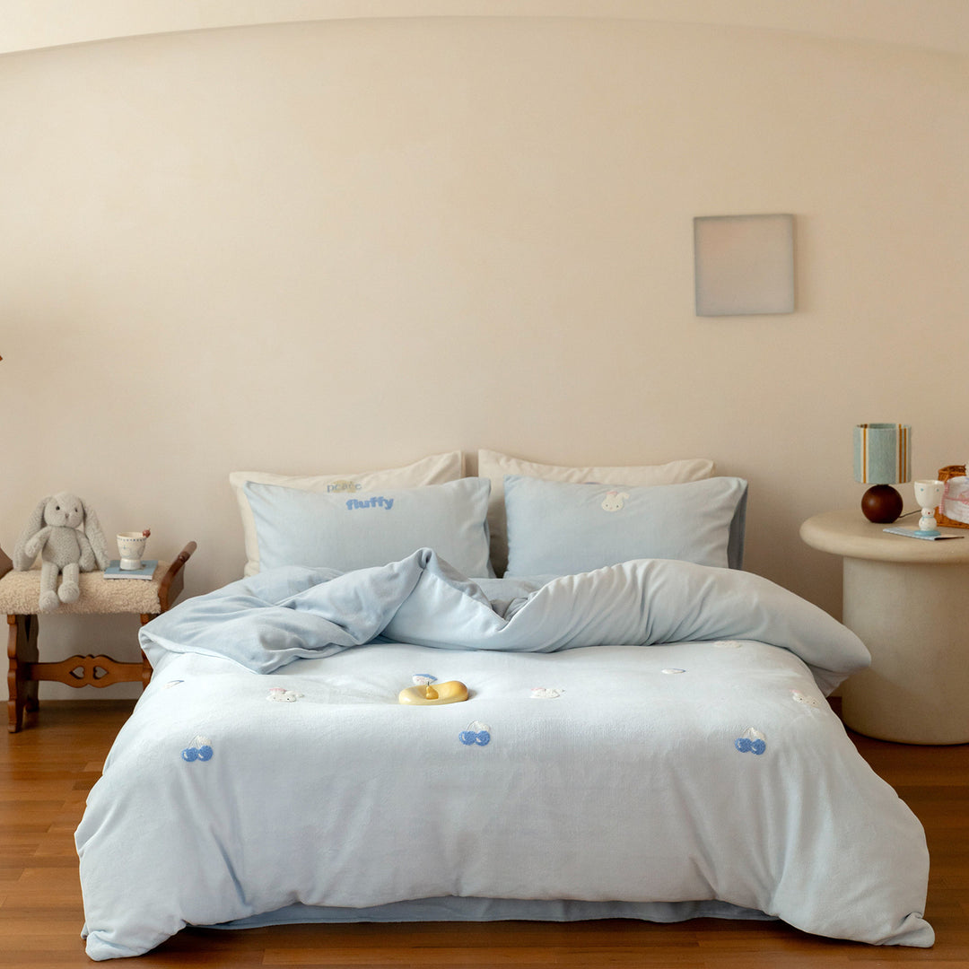 Cozy cotton bedding set with pom-pom appliques and embroidered lettering