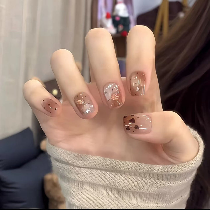 Artistic Nail Art Extensions with Metallic Accents