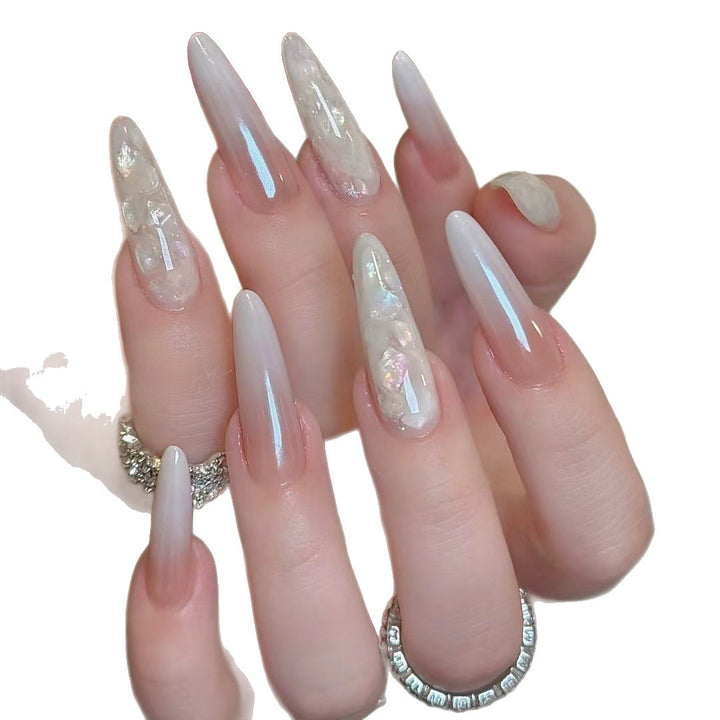 Glamorous Stiletto Nail Extensions with Decorative Accents
