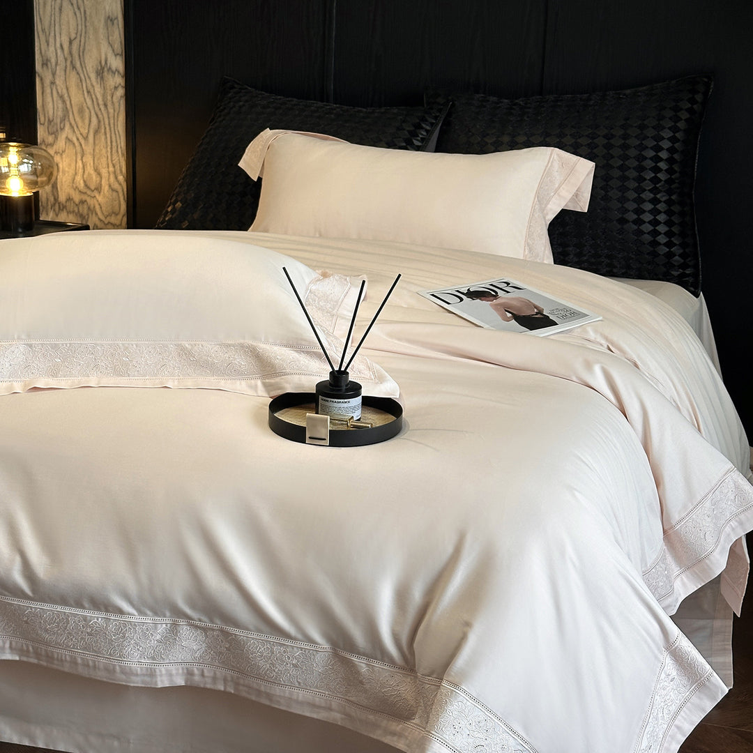 Premium cotton satin bedding set with integrated lace trim and delicate floral embroidery
