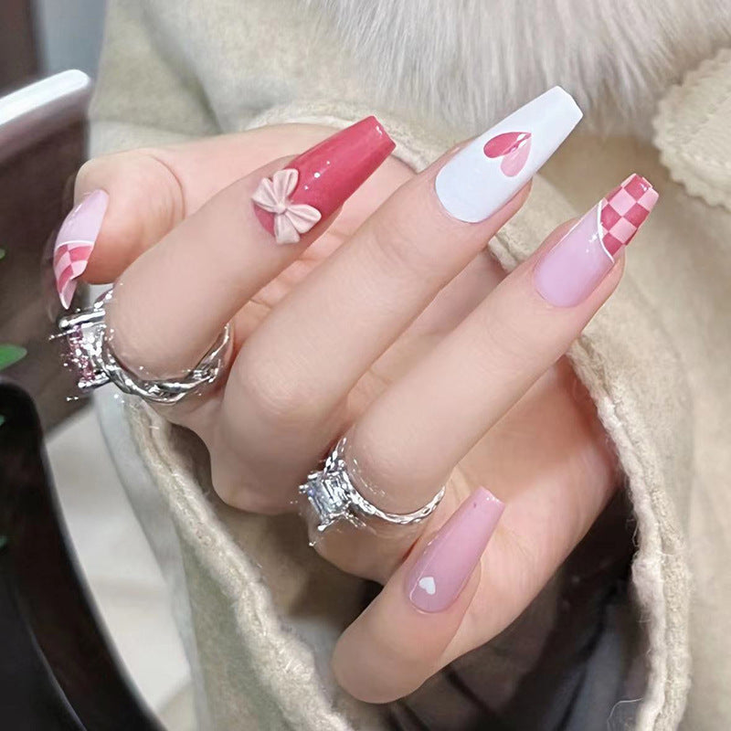 Artful nail extensions with playful designs and romantic accents Stornfield