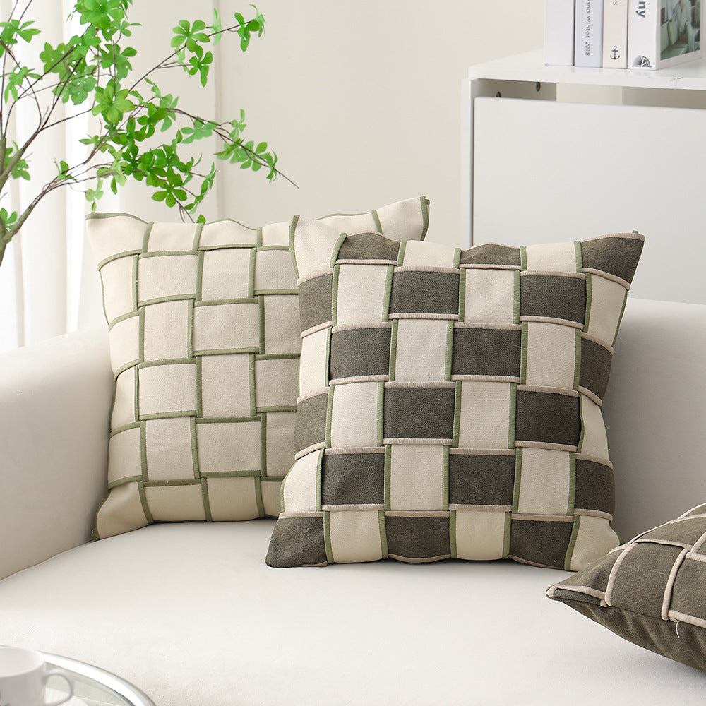 woven decorative pillow with braided square pattern