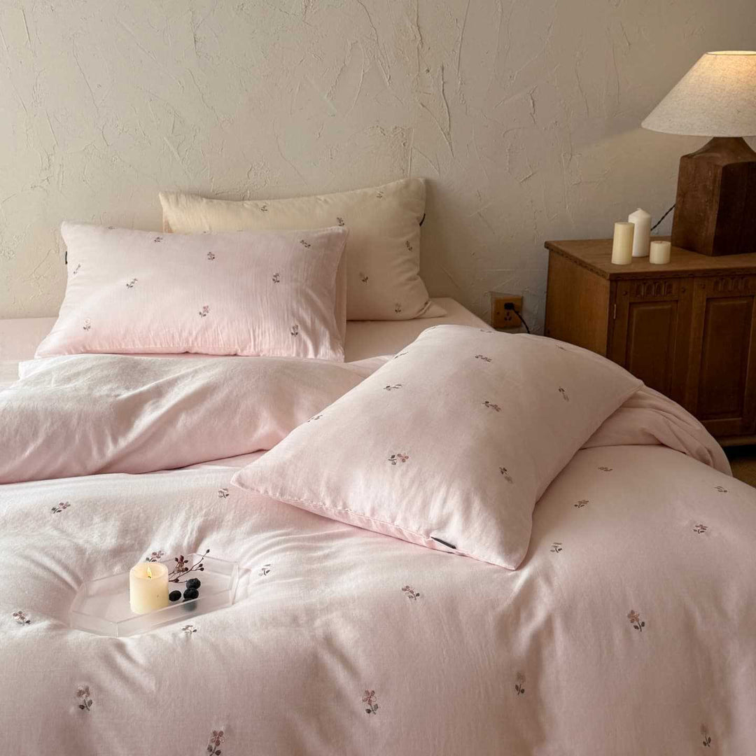 Breathable cotton bedding set with delicate flower embroidery and tie ribbon pillow
