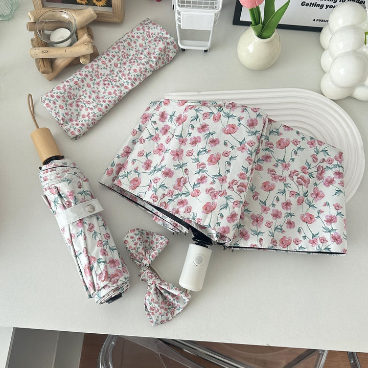 Women's folding umbrella with floral design and practical storage system Stornfield