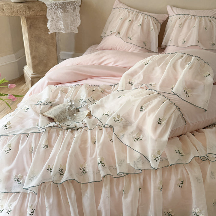 Vintage-inspired ruffle bed set with fine floral embroidery and ruched coverlet