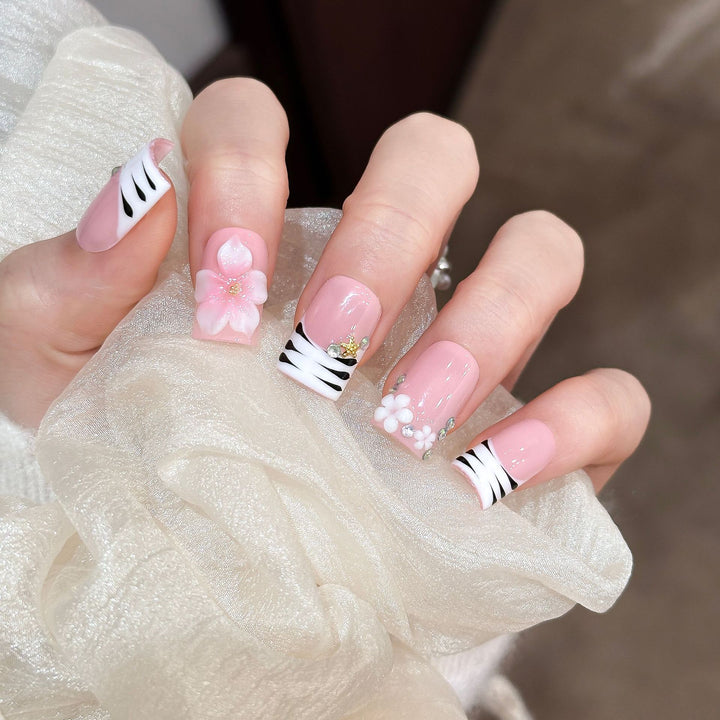 Artistic Press-On Nail Enhancements with Pattern and Gem Accents