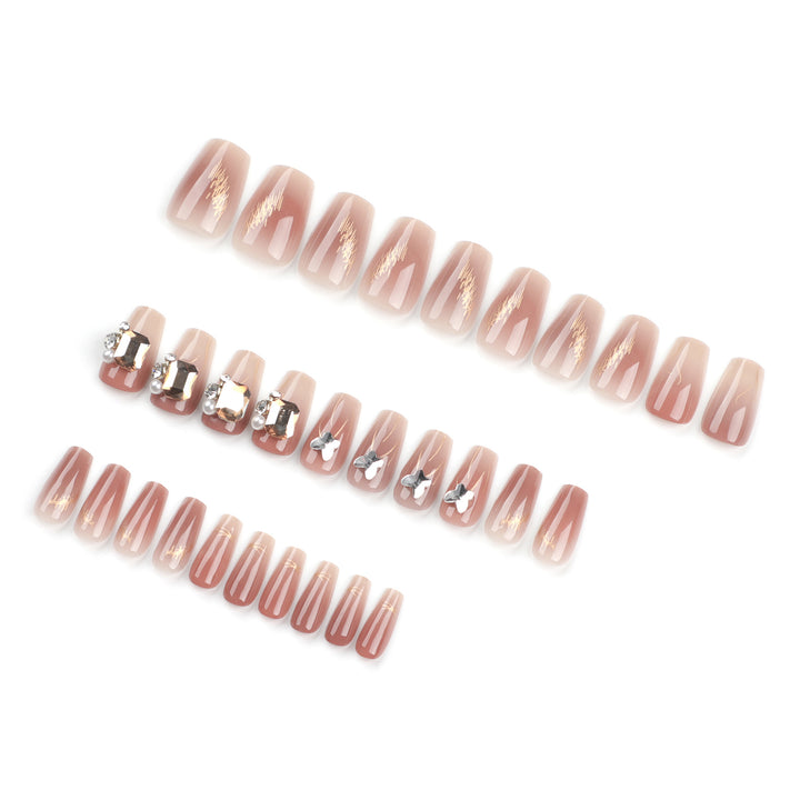 Artificial nail art with elegant jewelry accents Stornfield