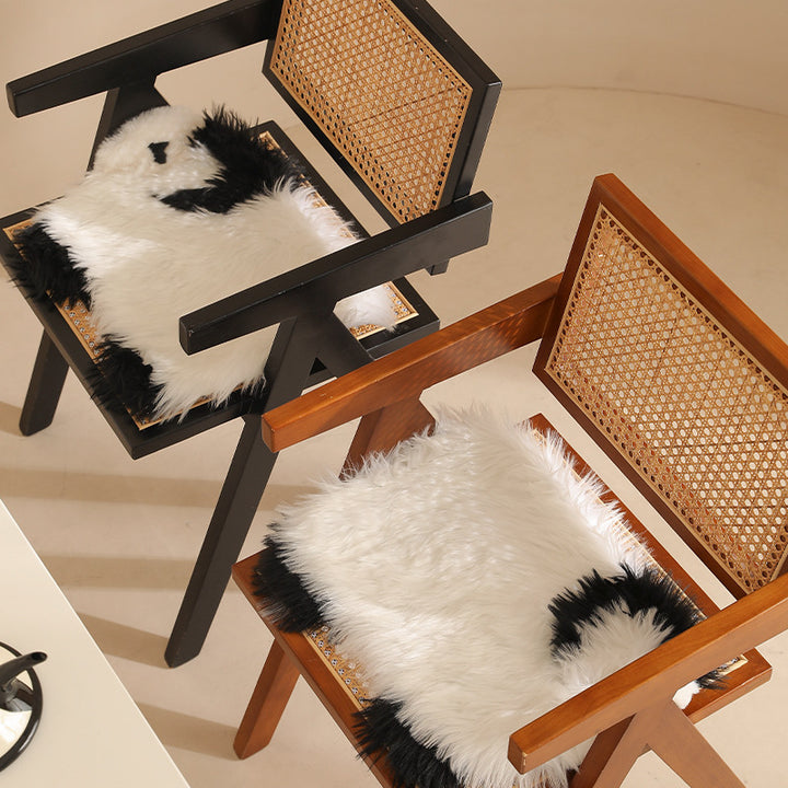Plush seat pouf in sheep shape with cuddly faux fur cover