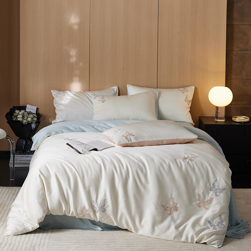 Reversible bedding set made of cotton percale with finely embroidered breakfast motifs