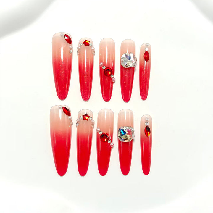 Artificial nails in elegant ombre style with glitter and jewelry accents Stornfield