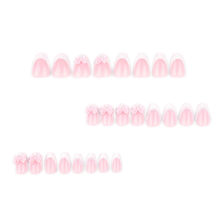 Artful Stiletto Nails with Delicate Bow Accents Stornfield