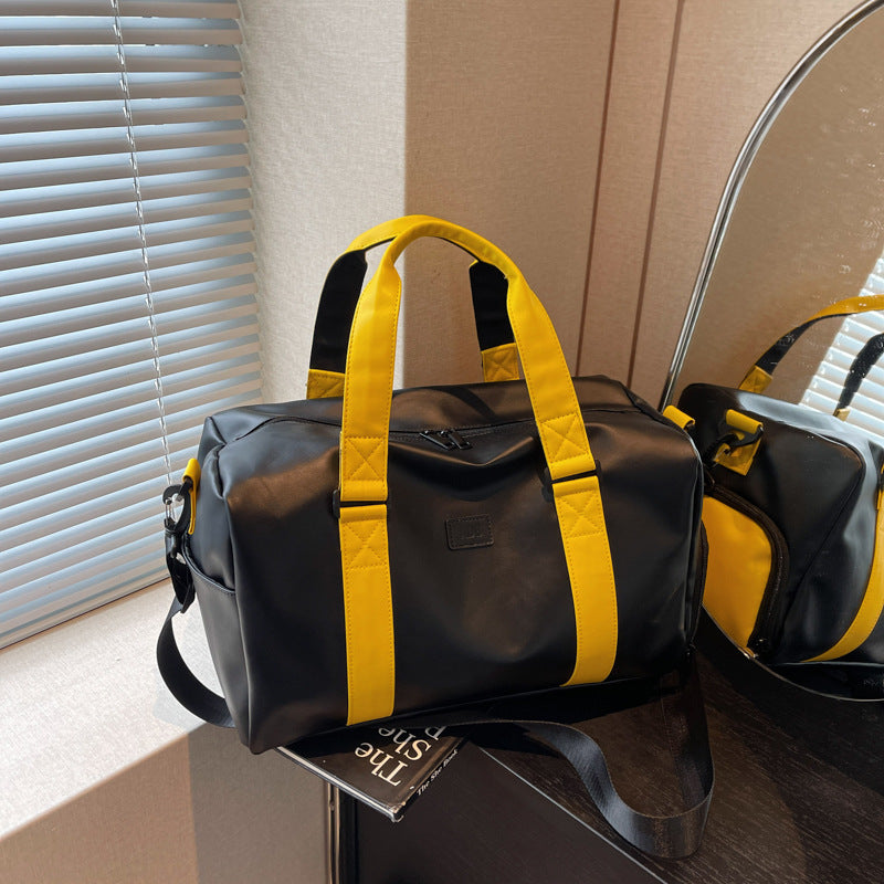 Sporty duffel bag with durable water-repellent material and versatile carrying options Stornfield