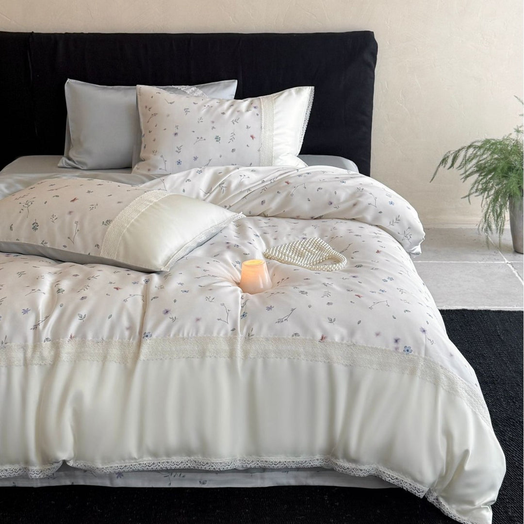 Cotton satin bedding set with delicate floral embroidery and lace trim